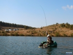 Dave landing a fish
