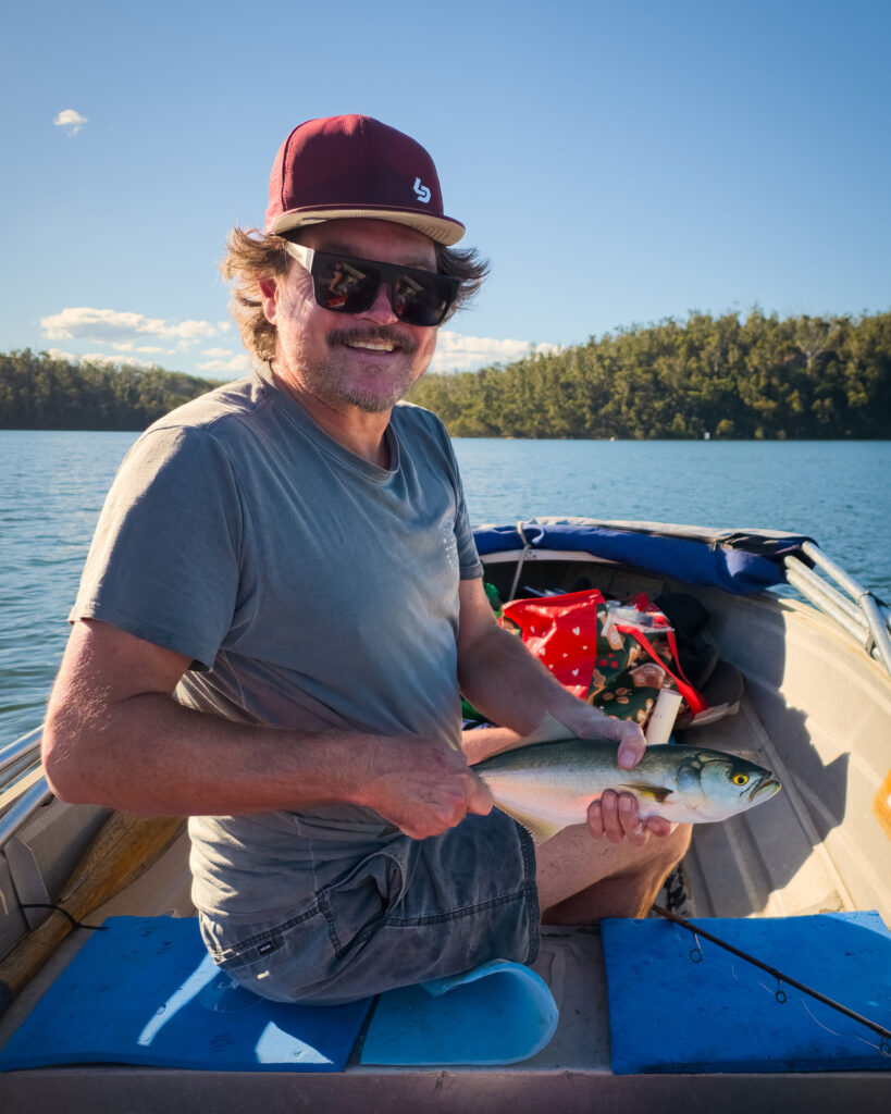 Paul with a tailor on Lake Conjola