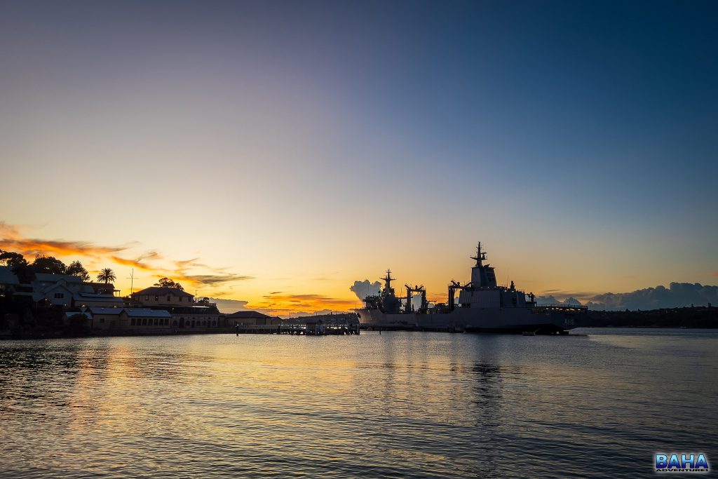 A military ship silhouetted by a glorious Clifton Gardens sunrise